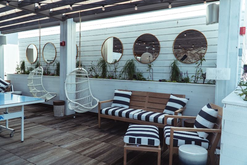 stylish decorated deck with a lounger area