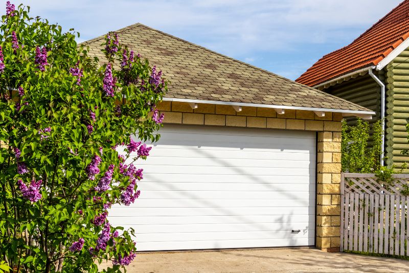 carport with a white gate
