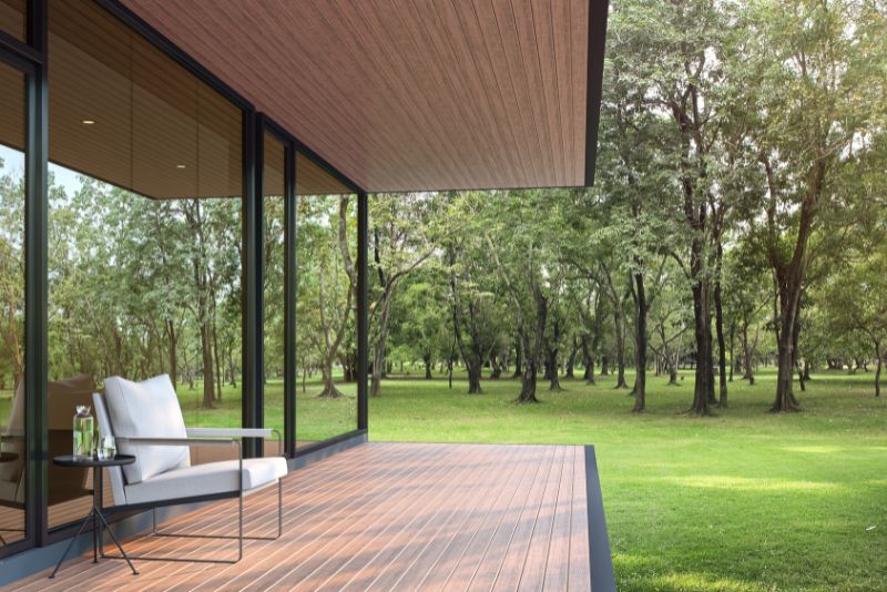 contemporary verandah with a chair and a small table