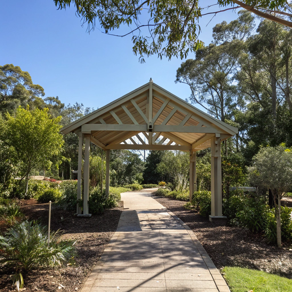Standalone pergola positioned in garden center with pathway in Ipswich property